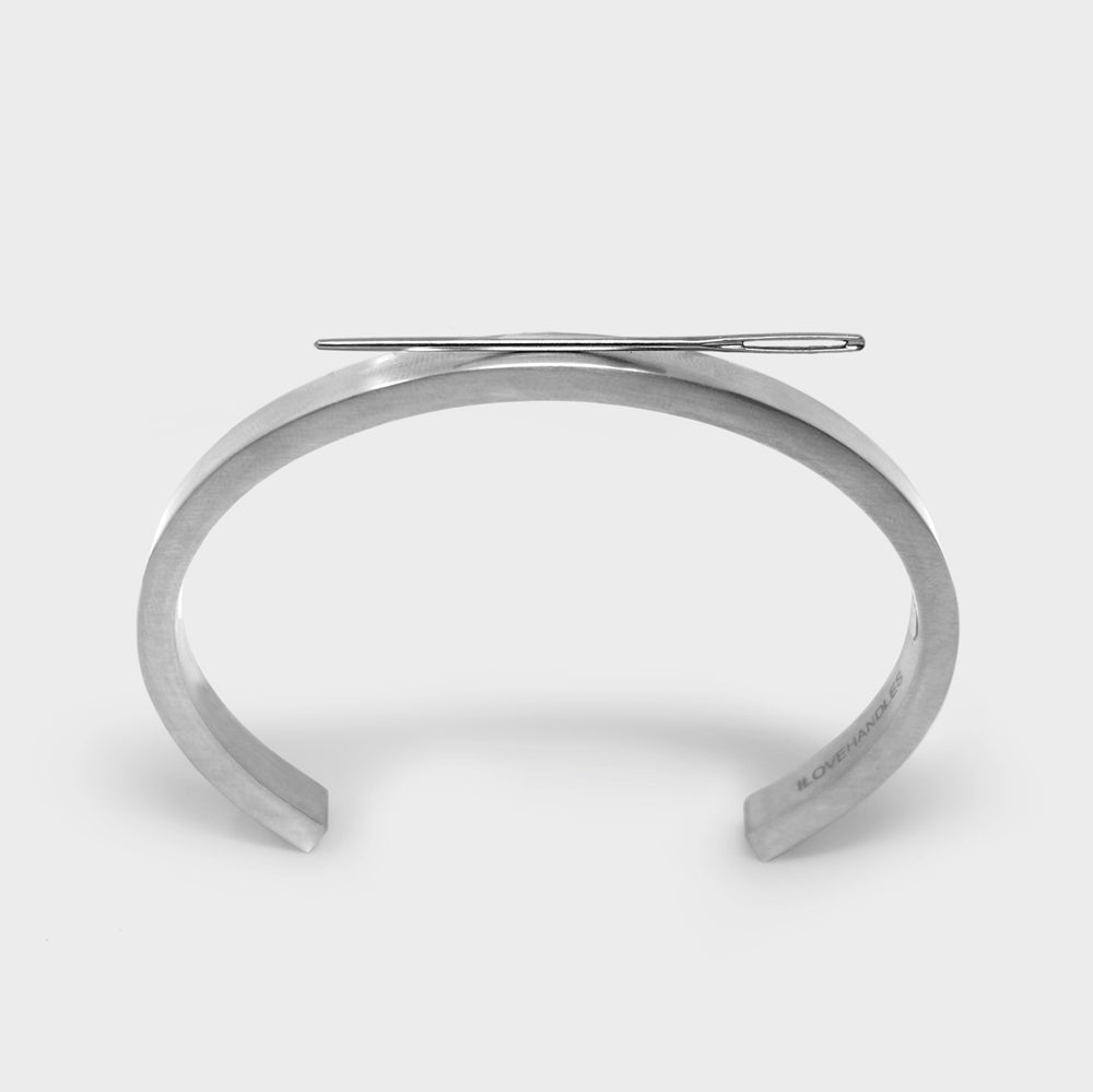 Stowaway is a clean, minimalist, solid magnetic stainless steel cuff. Simple and understated, it looks great on everyone. You can use it to hold any number of things: paperclips, screws, nails, pins, drill bits, etc. Use it as a tool when you need it; enjoy its good looks when you don’t. Available in two sizes.