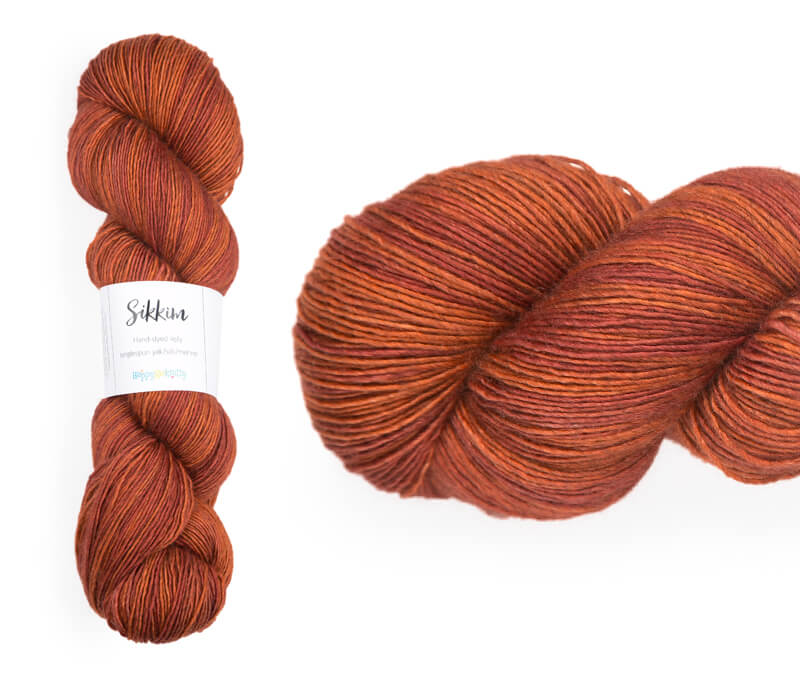 Hand-dyed single spun 15% yak / 20% silk / 65% superwash merino yarn. Colourway: Inferno. 4ply. The yak fibre is clearly visible, giving it a slightly heathered look. Very soft and drapes beautifully, so suitable for shawls. It can of course also be used for scarves, hats, baby clothes, or other 4ply knitting.