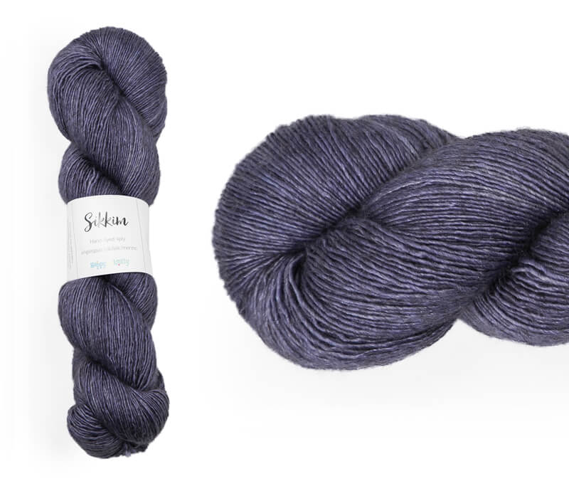 Hand-dyed single spun 15% yak / 20% silk / 65% superwash merino yarn. Colourway: Jacaranda. 4ply. The yak fibre is clearly visible, giving it a slightly heathered look. Very soft and drapes beautifully, so suitable for shawls. It can of course also be used for scarves, hats, baby clothes, or other 4ply knitting.