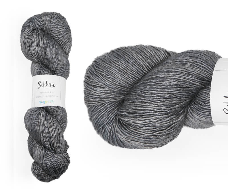 Hand-dyed single spun 15% yak / 20% silk / 65% superwash merino yarn. Colourway: Silver Pennies. 4ply. The yak fibre is clearly visible, giving it a slightly heathered look. Very soft and drapes beautifully, so suitable for shawls. It can of course also be used for scarves, hats, baby clothes, or other 4ply knitting.