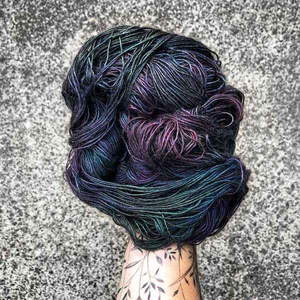 This yarn is hand painted with 12 colours. Colourway: Oil Slick. Available in Sikkim 4ply (singlespun 15% yak / 20% silk / 65% superwash merino), Mardi 4ply (20% yak / 20% silk / 60% superwash merino), Sinam 8ply (20% yak / 20% silk / 60% superwash merino), and Kashi 4ply (50% silk / 50% superwash merino).