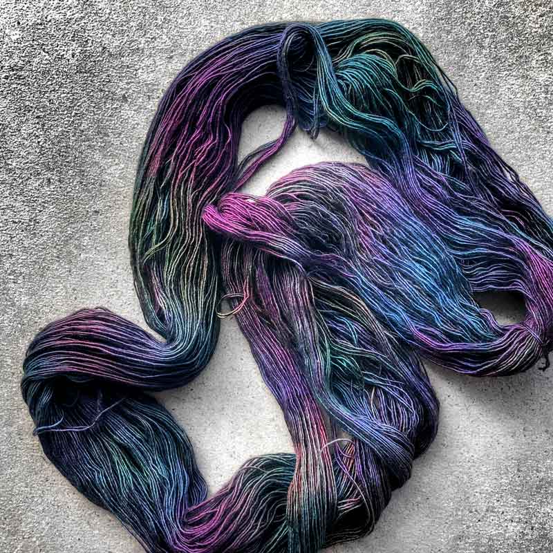 This yarn is hand painted with 12 colours. Colourway: Oil Slick. Available in Sikkim 4ply (singlespun 15% yak / 20% silk / 65% superwash merino), Mardi 4ply (20% yak / 20% silk / 60% superwash merino), Sinam 8ply (20% yak / 20% silk / 60% superwash merino), and Kashi 4ply (50% silk / 50% superwash merino).