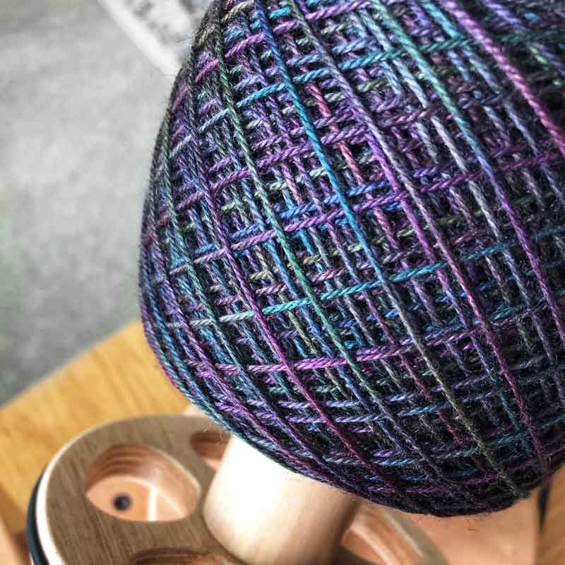 This yarn is hand painted with 12 colours. Colourway: Oil Slick. Available in Sikkim 4ply (singlespun 15% yak / 20% silk / 65% superwash merino), Mardi 4ply (20% yak / 20% silk / 60% superwash merino), Sinam 8ply (20% yak / 20% silk / 60% superwash merino), and Kashi 4ply (50% silk / 50% superwash merino).