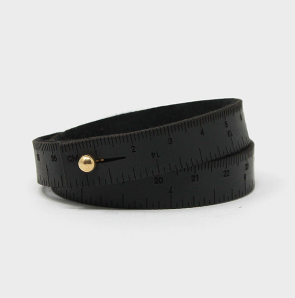Black leather wristband with engraved inch & centimeter measurements. Perfect if you find yourself always needing to measure things when you're on the go. Sizes are based on wrapping around your wrist twice. The stud closure is nickel-free, made from chrome-plated brass. Different sizes available.