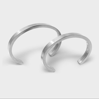 Stowaway is a clean, minimalist, solid magnetic stainless steel cuff. Simple and understated, it looks great on everyone. You can use it to hold any number of things: paperclips, screws, nails, pins, drill bits, etc. Use it as a tool when you need it; enjoy its good looks when you don’t. Available in two sizes.
