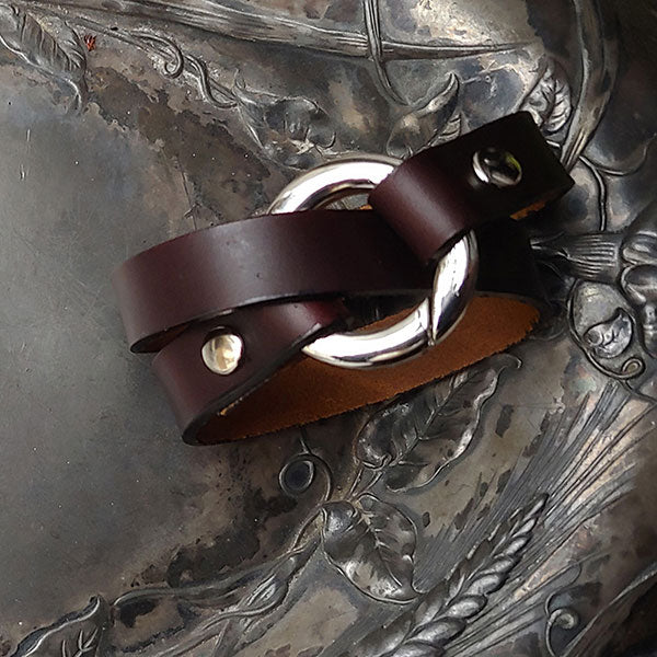 Bezel Leather Shawl Cuff by JUL Designs. Genuine leather available in black, espresso, pewter, and plum. Ring available in glossy nickel or satin finished antique brass. Length: approx 330 mm (13"), circumference when wrapped approx 165 mm( 6.5").