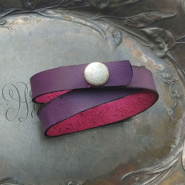 The Simple Snap Shawl Cuff is made from a hand-cut 13mm wide strip of supple, smooth leather in four colours, closed with the snap metal of your choice. The Simple Snap wraps twice around knitwear and closes with a snap. It can also be worn wrapped once as a leather choker necklace or wrapped twice as a bracelet.