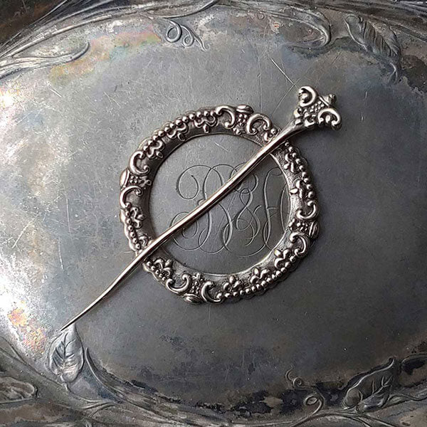 Fleur de Lis Shawl Pin by JUL Designs in white brass. Fleur de Lis - the classic, familiar and elegant motif depicting three petals bound together. Hand-made Fair Trade in Indonesia.