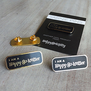 High quality enamel pin with the text: I AM A Happy-go-knitter. Available in silver or gold. Size: 42mm x 16mm with 2 pin backings to prevent the pin from spinning around.