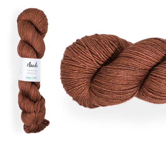 Hand-dyed, 20% yak / 20% silk / 60% superwash merino yarn. Colourway: Gingerbread Man. 4ply, 100g skeins/approx 365m. A luxurious yarn spun from exotic fibres. This yarn is silky and drapey so it works very well for shawls but can also be used for that special garment. 