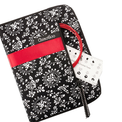 Image of the closed complete set from ChiaoGoo contains 13 cm lace tips made of surgical-grade stainless steel. The TWIST red cables are memory-free! Also included with each set are easy-to-read coded cable connectors, end stoppers, T-shaped tightening keys, stitch markers, a needle gauge, and a compact zipper-enclosed, fabric case.