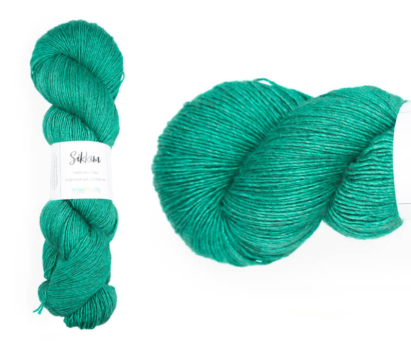 Hand-dyed single spun 15% yak / 20% silk / 65% superwash merino yarn. Colourway: Emerald Lake. 4ply. The yak fibre is clearly visible, giving it a slightly heathered look. Very soft and drapes beautifully, so suitable for shawls. Can of course also be used for scarves, hats, baby clothes, or other 4ply knits.