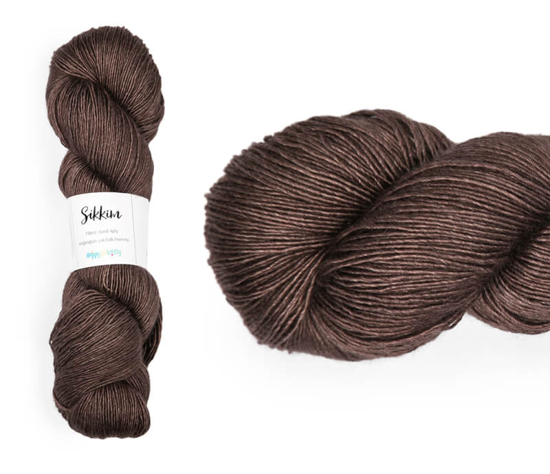 Hand-dyed single spun 15% yak / 20% silk / 65% superwash merino yarn. Colourway: Melting Chocolate. 4ply. The yak fibre is clearly visible, giving it a slightly heathered look. Very soft and drapes beautifully, so suitable for shawls. It can of course also be used for scarves, hats, baby clothes, or other 4ply knitting.