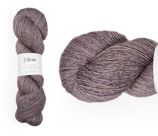Hand-dyed single spun 15% yak / 20% silk / 65% superwash merino yarn. Colourway: Mysterious Mauve. 4ply. The yak fibre is clearly visible, giving it a slightly heathered look. Very soft and drapes beautifully, so suitable for shawls. It can of course also be used for scarves, hats, baby clothes, or other 4ply knitting. 