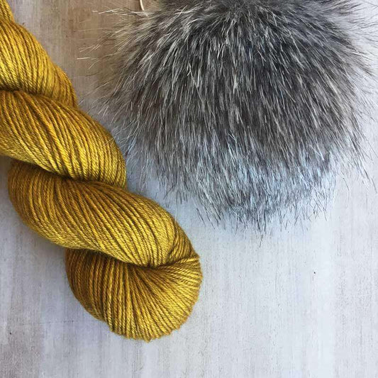 Kit for Twist and Slouch Beanie. The kit includes 100g Sinam (DK yak/silk/merino) in colourway: English Mustard + 1 pompom Silver Fox. The pattern for Twist and Slouch by Handmade by Smine is not included. Other combos of yarn and pompom can be made to order. Make sure to swatch as this beanie has a firm fabric.