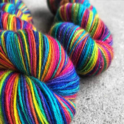 Self-striping rainbow sock yarn. Dyed with no less than 14 colours! Available in Dartmoor and Shangri-la. This yarn is hand-dyed, colour variations are intentional. After dyeing, the yarn has been thoroughly washed and rinsed. Shop at Happy-go-knitty today!