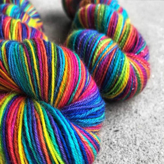 Self-striping rainbow sock yarn. Dyed with no less than 14 colours! Available in Dartmoor and Shangri-la. This yarn is hand-dyed, colour variations are intentional. After dyeing, the yarn has been thoroughly washed and rinsed. Shop at Happy-go-knitty today!